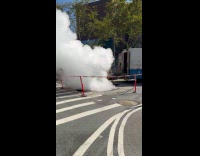 Large smoke comes out of street sewer
