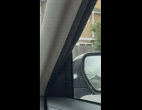 Man in a car with an upside down office chair