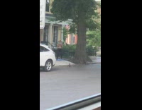 Guy lifts cinder block sidewalk phone tripod 