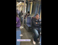 Guy wears white scary make up stitched mouth with top hat on subway train