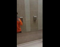 Guy in restroom fixing his hair and hears guy pooping in stall