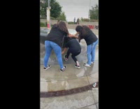 Girl goes under fountain waterfall 