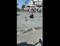 Girl black shirt yoga sit middle street