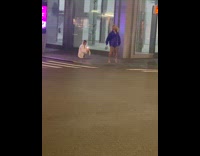 Woman blue glittery coat dance street night