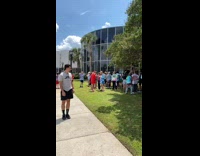 Man front flip near the students and gave him some money