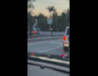 Man shirtless selfie video on the car roof