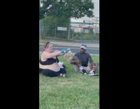 Woman season chicken on grass 