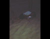 Guy in cardigan robe and white mask runs at guy on beach drop kicks back