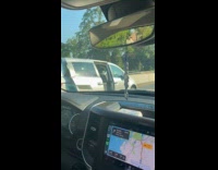 SUV drive on highway with open door