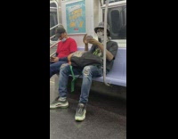 Guy plays with floating glass ball subway 