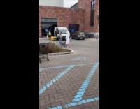 Woman wears bathrobe and towel at parking