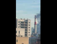 Men filming music video on rooftop