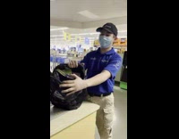 Man shows shoplifters bag full of canned meat