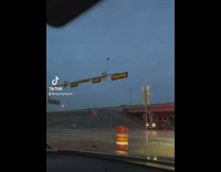 Streetlight sign shaking up and down 