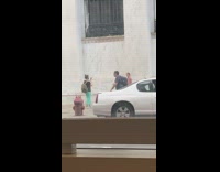 Girl beige dress white wall white car