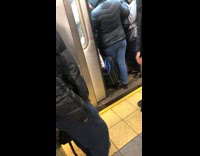 Lady holds up busy subway