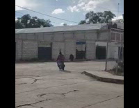 Guy rides toy motorcycle dirt bike bottle 