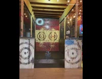 Guy on skateboard throws axe behind back