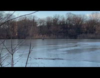 Man runs and slides across ice 