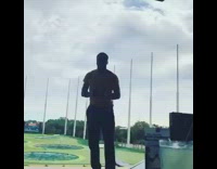 guy lets go of golf club goes backwards