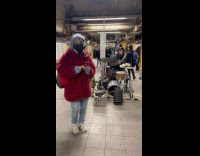 Drummer and DJ performing at subway station
