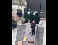 Guy take selfie with his dog at the rooftop at day