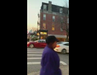 red car driving with bumper on roof