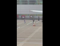 Girl shakes head for photos at airport 