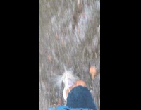 Woman talk while walking on flood water