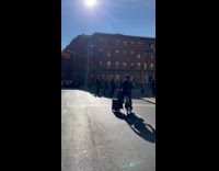 Collab winy - Guy pulls luggage while biking on road