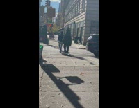 Man wearing christmas tree crossing the street