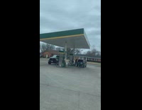 Gasoline station roof sways by the strong wind