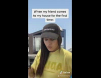 Yellow shirt girl shows off family photos 