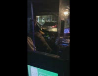 Taxi uber driver shows off bird to passenger 
