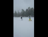 Girl black jacket spin and pose snow