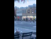 Collab WINY - Group of roller skaters pass by on street