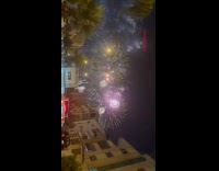 Fireworks in sky seen from the street