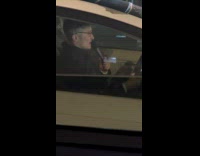 Man sing hold microphone drive car night