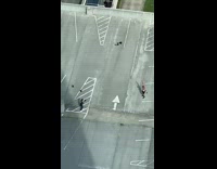 Man shirtless exercise with stretch band on the rooftop parking lot