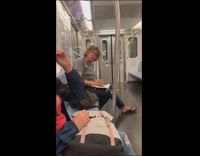 Racist man yells racist homophobic slurs at two gay men and a woman on the subway train