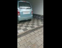 Guy bangs metal bowl puppy emerges van 