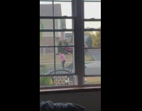 Man and woman tiktok dance middle of street neighborhood