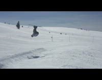 Collab JerrySlams - Skier backflips in slow motion then lands on back red skis