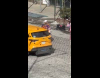 Guy shows outfit in middle of street