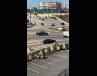 Girl blue hair sit on barricade street