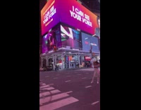 White pants girl poses times square street