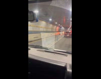 Car in flames inside of the tunnel