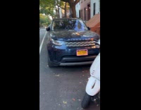 Three vespa scooters lay on the ground
