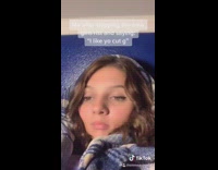 Girl lip syncs bed blue wall emo 