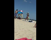 Guy red bikini girl fedora hat  beach